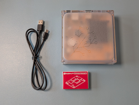 Image showing a Yellow, USB-C cable, and a Raspberry Pi Compute Module 5